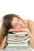Girl asleep on books