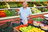 Senior man shopping for vegetables
