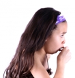 A young girl coughing