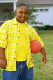Obese boy holding ball
