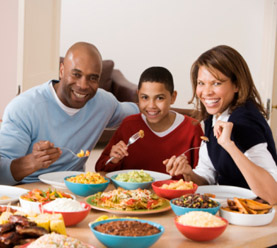 Happy family eating together