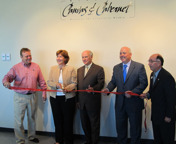 Ribbon cutting with Omaha Mayor Jim Suttle and Larry Gomez of the Greater Omaha Chamber of Commerce to commemorate the opening of Village Canvas and Cabernet.