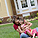 Mother and daughter on lawn