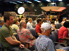As part of a celebration of 35 years of flight for NASA's Voyager spacecraft, a crowd of engineers and scientists at NASA's Jet Propulsion Laboratory