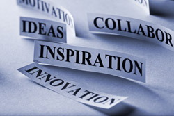 pieces of paper with words like "inspiration" and "creativity"