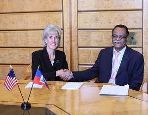 Secretary Sebelius with Haitian Prime Minister of Health Alex Larsen at World Health Assembly in Geneva