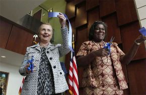 Date: 01/16/2012 Description: U.S. Secretary of State Hillary Clinton, left, attends a ribbon-cutting ceremony for the new U.S. Embassy with U.S. Ambassador to Liberia Linda Thomas-Greenfield in Monrovia Monday, Jan. 16, 2012. Clinton attended the second presidential inauguration of Africa's first woman president, Liberian President Ellen Johnson-Sirleaf, earlier in the day. (AP Photo/Larry Downing, Pool) © AP Image