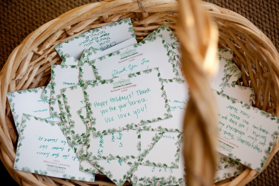 Thank you cards for servicemen and women are collected during a holiday tour