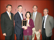 CDC researcher Dr. Claire Huang (center) receiving CO-LABS “High Impact Research Award” from Colorado Governor John Hickenlooper in November 2011