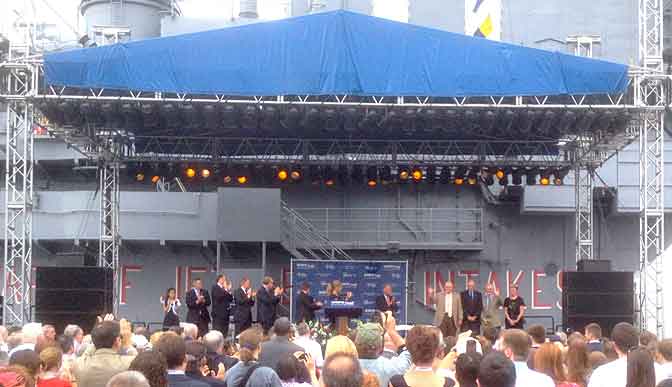 The four NASA astronaut-pilots who flew the prototype space shuttle Enterprise during its Approach and Landing tests at NASA's Dryden on Edwards Air Force Base received a standing ovation during the official turnover and unveiling ceremonies for Enterprise on the Intrepid Air, Sea and Space Museum.