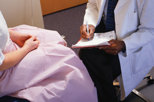 woman and doctor before a gynological exam