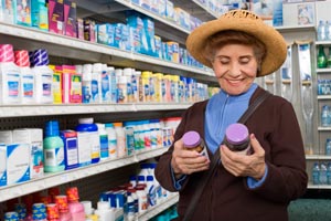 woman at a store comparing medication