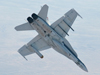 NASA Dryden's F/A-18 No. 852 rolls into a 40-degree dive during verification and validation flight tests of the Mars Science Laboratory's landing radar housed in a pod under its left wing.