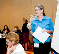 Sarah Lyon Callo leads a group discussion at a NACI meeting in Baltimore, MD.