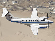 King Air in flight over Rogers Dry Lake Bed.