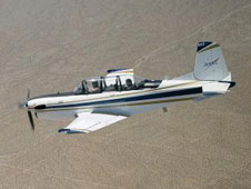 Chase aircraft such as the T-34C accompany research flights for photography and video purposes.