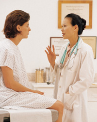 Photo: A woman talking with her healthcare professional