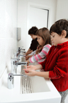 Children washing their hands at school