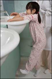 Photo: A girl washing her hands