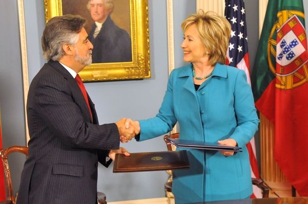 Date: 06/05/2009 Description: Secretary Clinton shakes hands with Portuguese Foreign Minister Luis Amado after signing the U.S.-Portugal Extradition and Mutual Legal Assistance Treaties. State Department photo by Michael Gross 