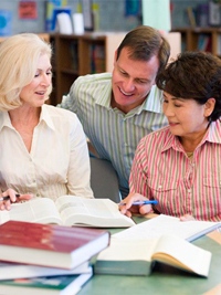 teachers looking at books together