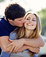 Photo: Adolescent boy and girl hugging