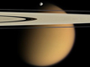 Titan seen behind Saturn's rings