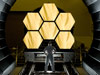 NASA engineer Ernie Wright looks on as the first six flight ready James Webb Space Telescope's primary mirror segments are prepped to begin final cryogenic testing at NASA's Marshall Space Flight Center in Huntsville, Ala.