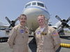 Pilots Mike Singer, left, and Shane Dover stand in front of the 117-foot P-3B NASA research aircraft on the tarmac at Baltimore/Washington International Thurgood Marshall Airport, Tuesday, June 28, 2011, in Baltimore, Md.