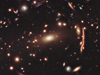 Galaxies are distorted by dark matter in this hubble image of cluster MACS 1206
