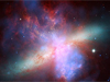 composite image of galaxy M82 created with Hubble, Chandra and Spitzer telescope data