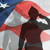 image of a military person silhouetted in front of the American flag