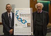 Eric Green and James Watson beside poster of Jean Mitchell Watson Lecture 2010. 