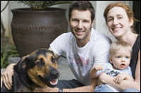 Photo: A family with their dog.