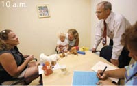 Dr. William Gahl (right) of the National Human Genome Research Institute meets with Lanna (left), Channing's mom