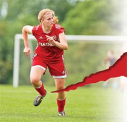 A photo of a Michelle Backus running playing soccer.