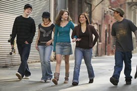 Photo: A group of teenagers walking down an urban street