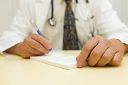 Photo: Doctor writing a prescription