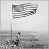 Thumbnail image of a soldier near the American flag in Iwo Jima.