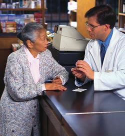 A woman talking to a pharmacist