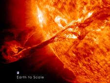 SDO's view of erupting filament on the sun with Earth shown next to it for scale.