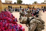 U.S. Soldiers Give Backpacks to Children