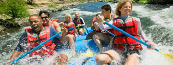 Photo: A group of people white water rafting.