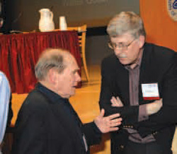 Nobel Laureate Dr. Sydney Brenner (left) discusses GenBank with Dr. Francis Collins