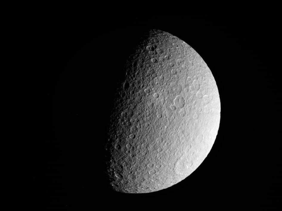NASA's Cassini spacecraft took this raw, unprocessed image of Saturn's moon Rhea on March 10, 2012