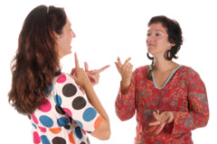 Two deaf women signing