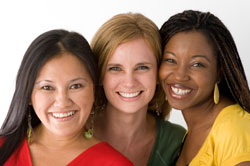 Three women smiling