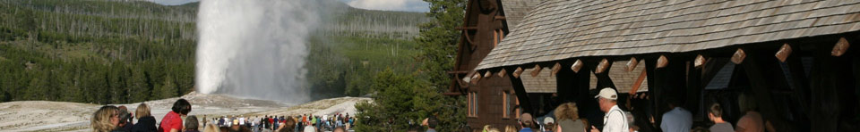 Visitors enjoy an eruption of Old Faithful from the Inn.