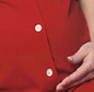 Pregnant lady in red shirt holding stomach