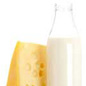 Photo: A slice of cheese and a bottle of milk